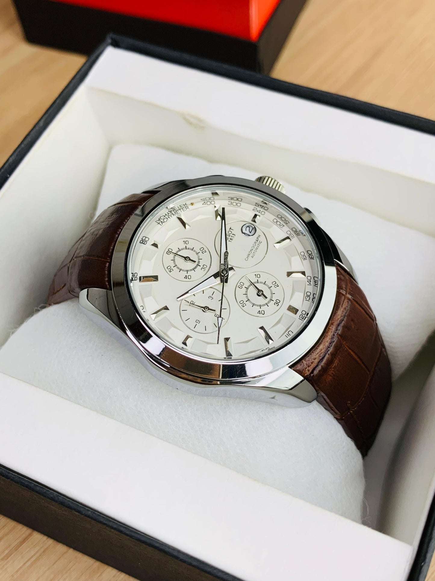 Classic Chronograph Watch with Textured Leather Strap and Multifunction Dial